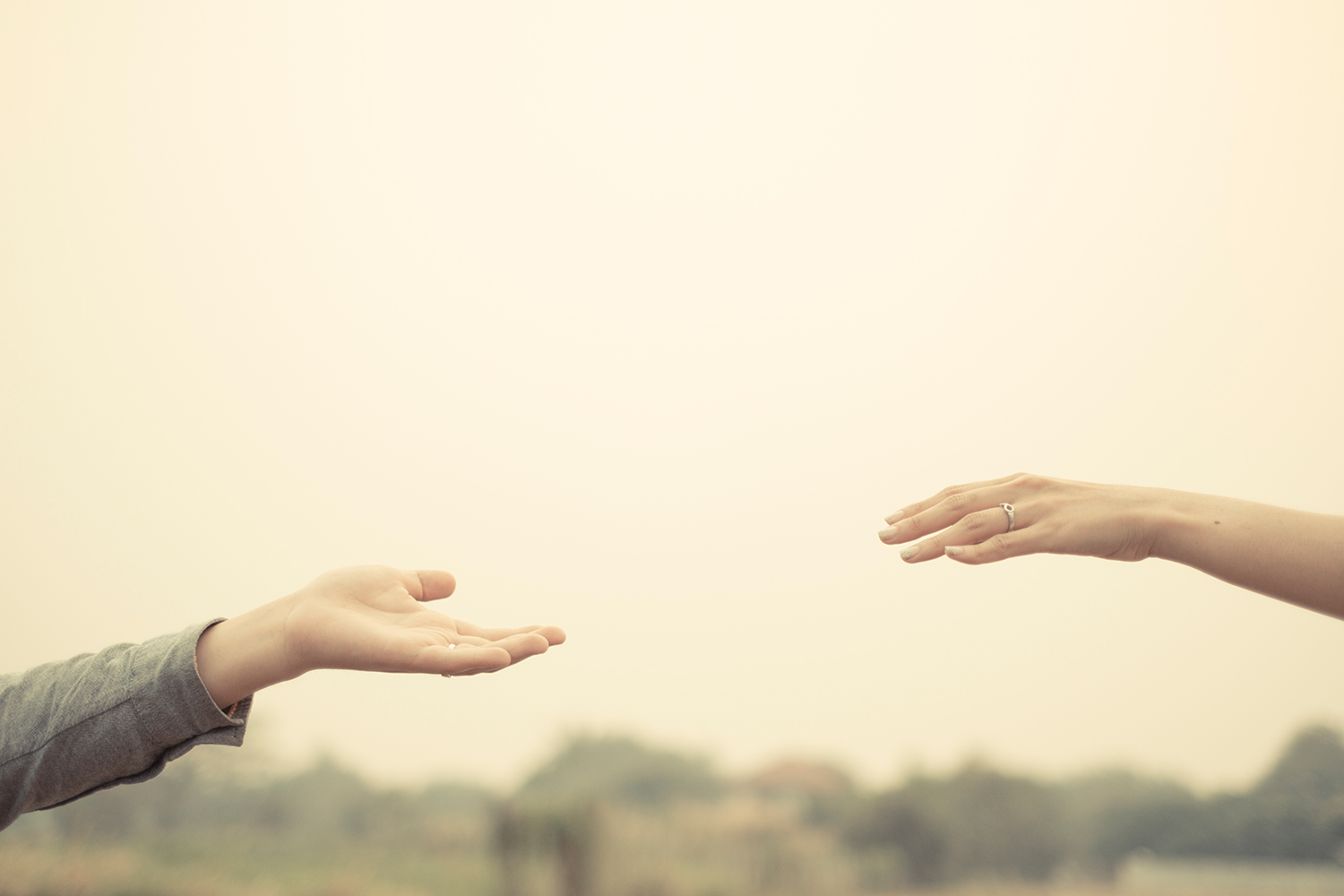 couple-hand-together-touch-with-love-vintage-filter-tone-SBI-301086055